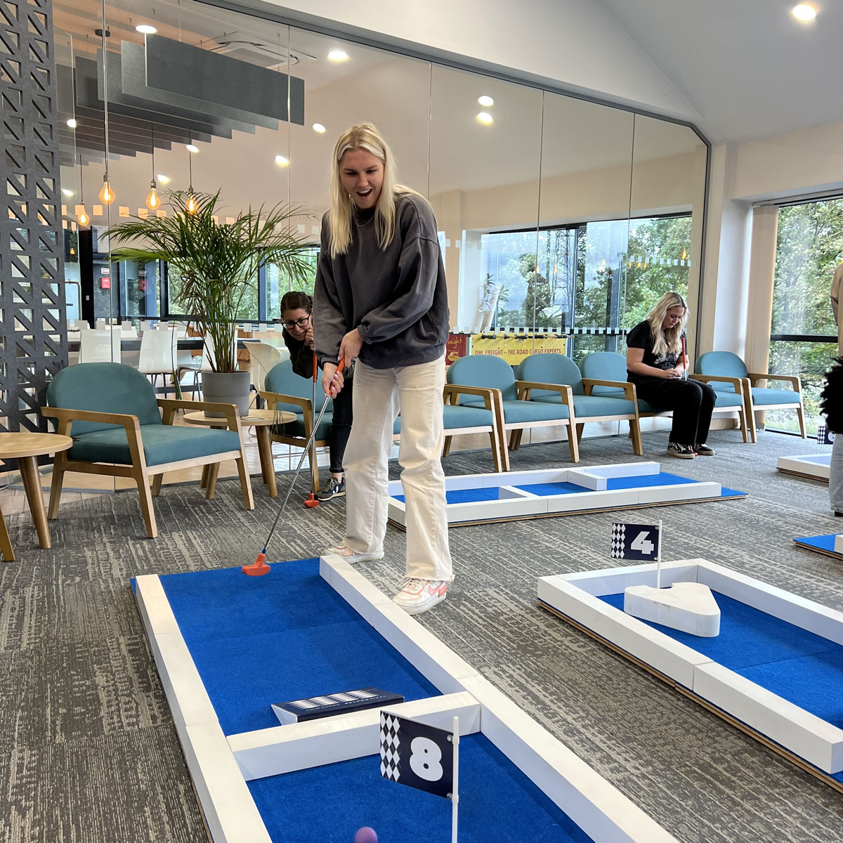 Crazy Golf Team Bonding - Workplace Putt-Off Event Team bonding with a portable crazy golf course at the office